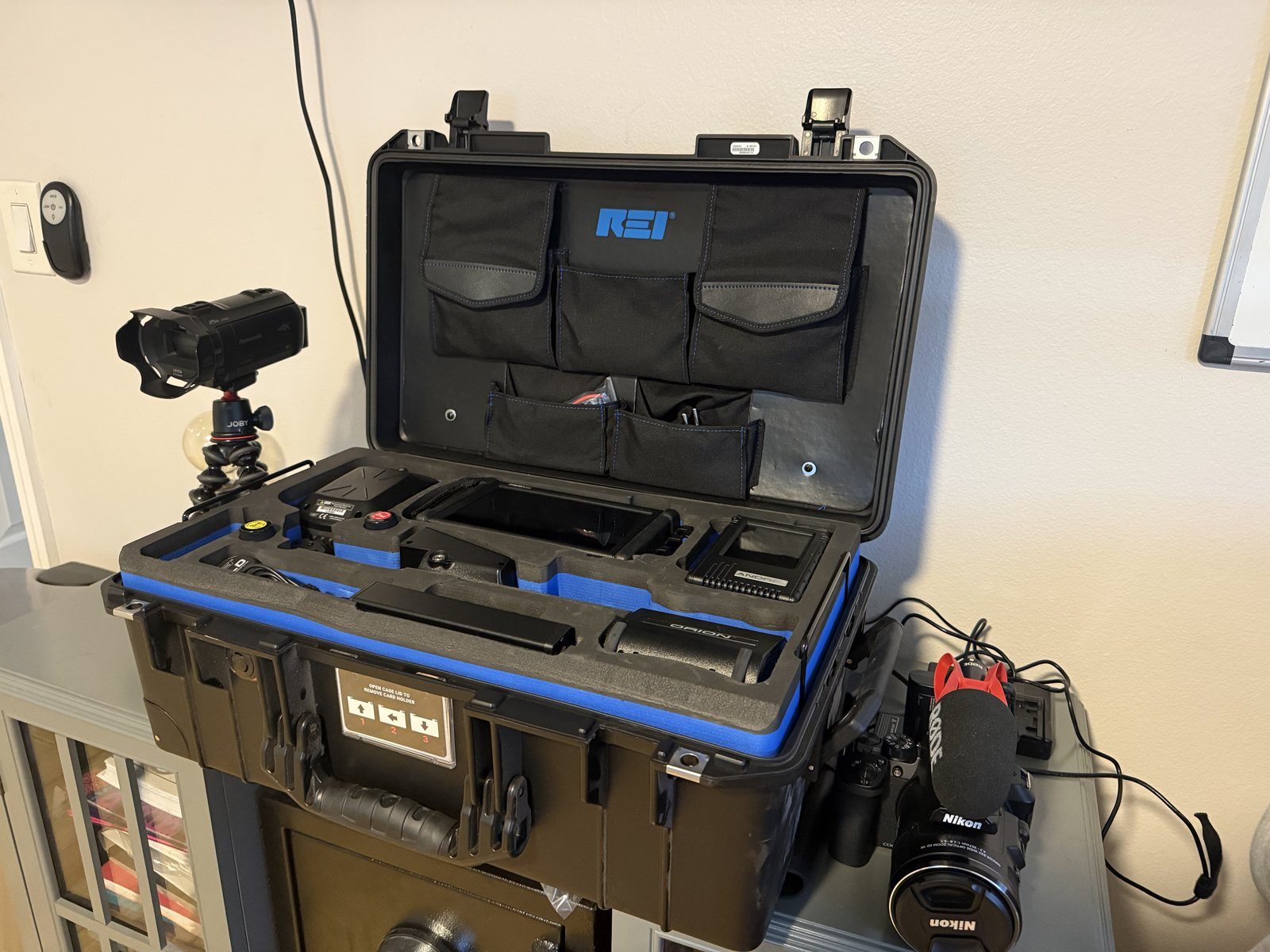 The REI technical surveillance countermeasures sweep kit used by Insight Investigative Group, with long lens camera and 4K camcorder