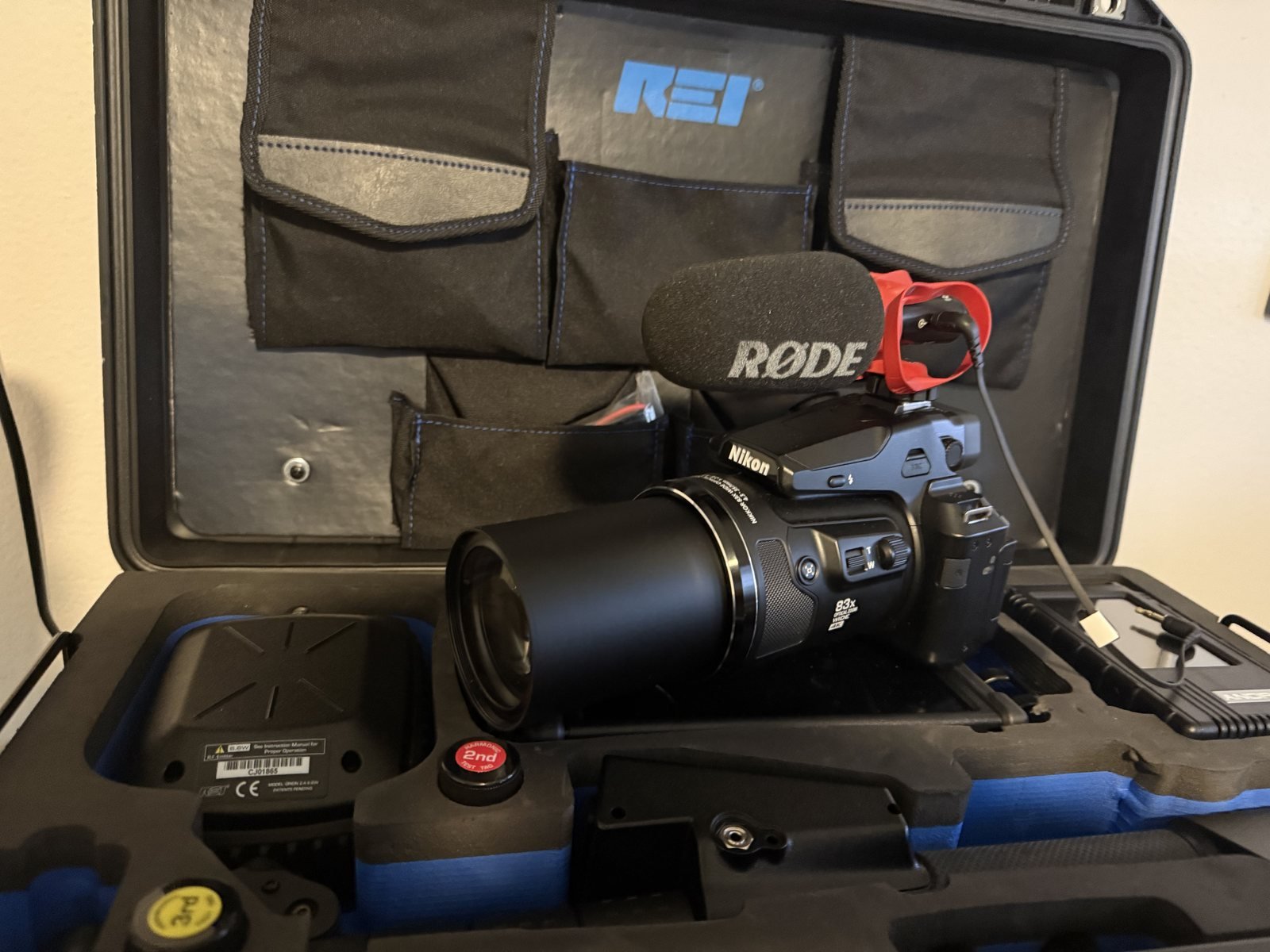 A long lens surveillance camera with a directional microphone, packed in the equipment case used by Insight Investigative Group